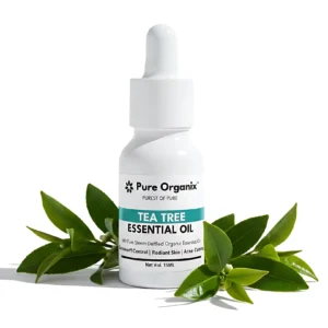 Pure Organix Tea Tree Essential Oil bottle with natural leaves, highlighting its uses for Dandruff Control, Radiant Skin, and Acne Control.