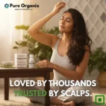 Woman gently massaging rosemary essential oil onto her scalp for hair follicle stimulation and soothing scalp care experience.